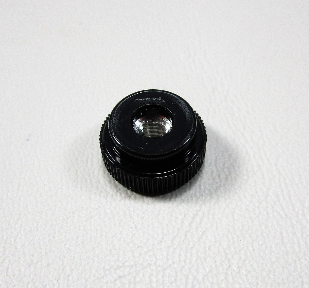 Black plastic thumb nut with 8-32 threaded metal insert, used for fastening or securing components.