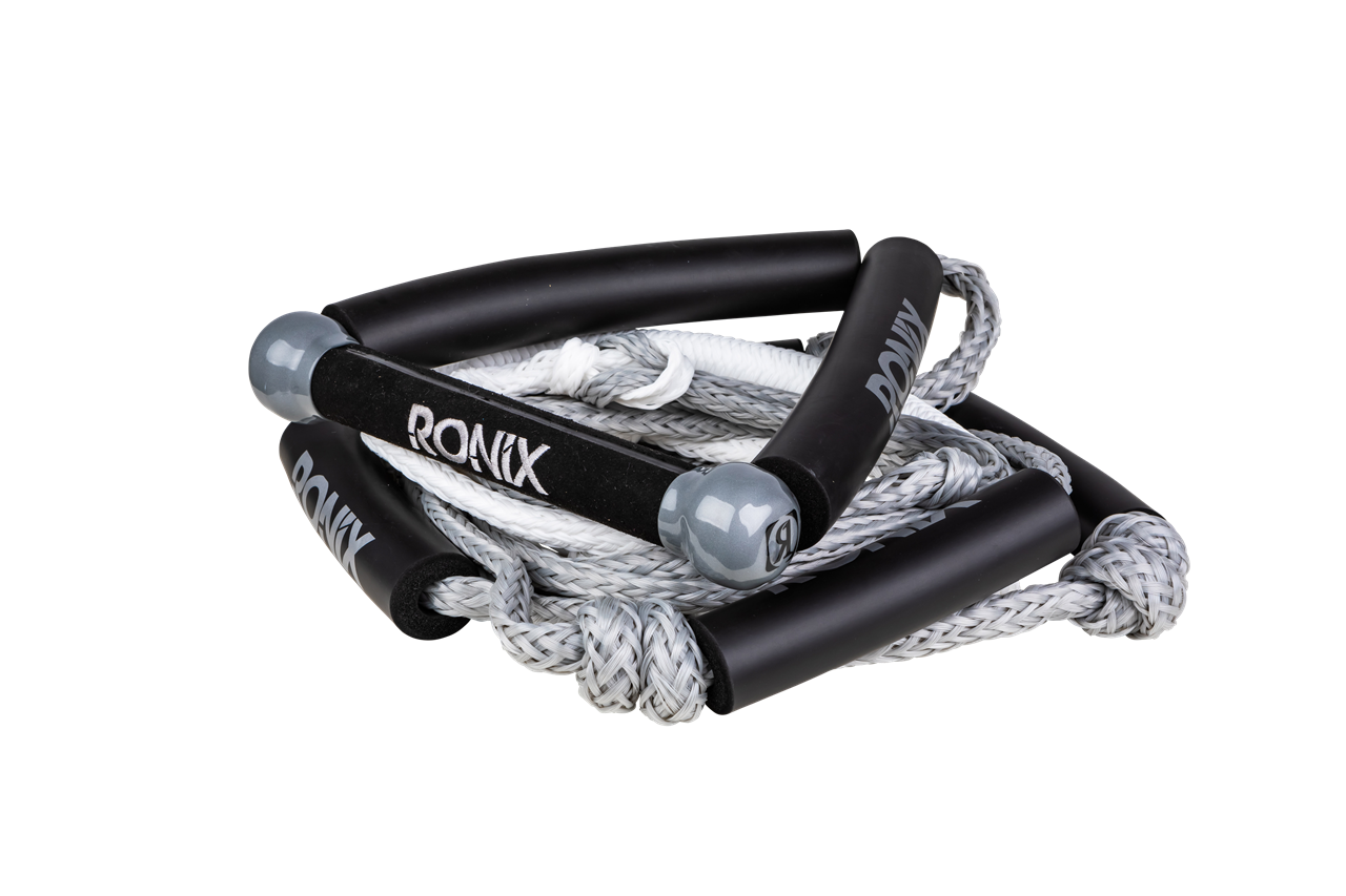 2025 Ronix Bungee Surf Rope with Handle, featuring black foam grips, white braided rope, and durable construction for water sports.