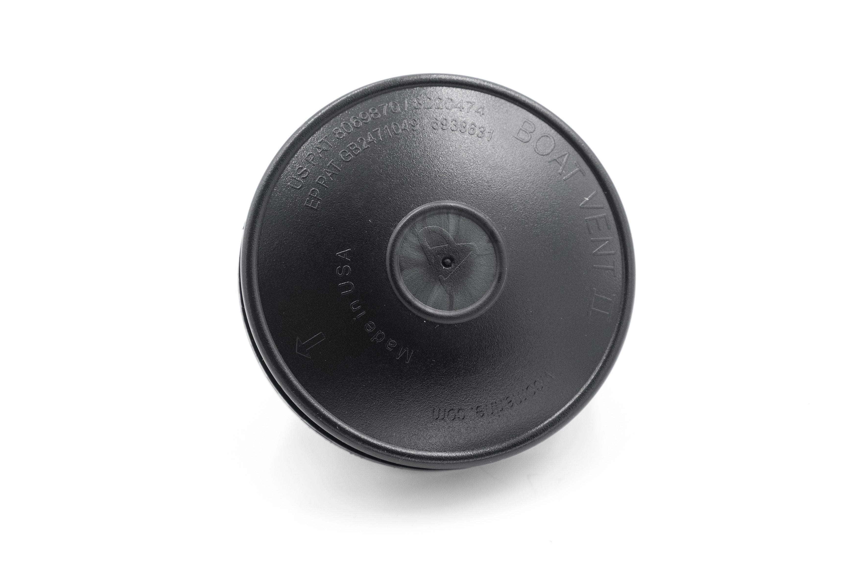 Black cover vent with embossed text, arrows, and manufacturing details, designed to fit over a vent opening.