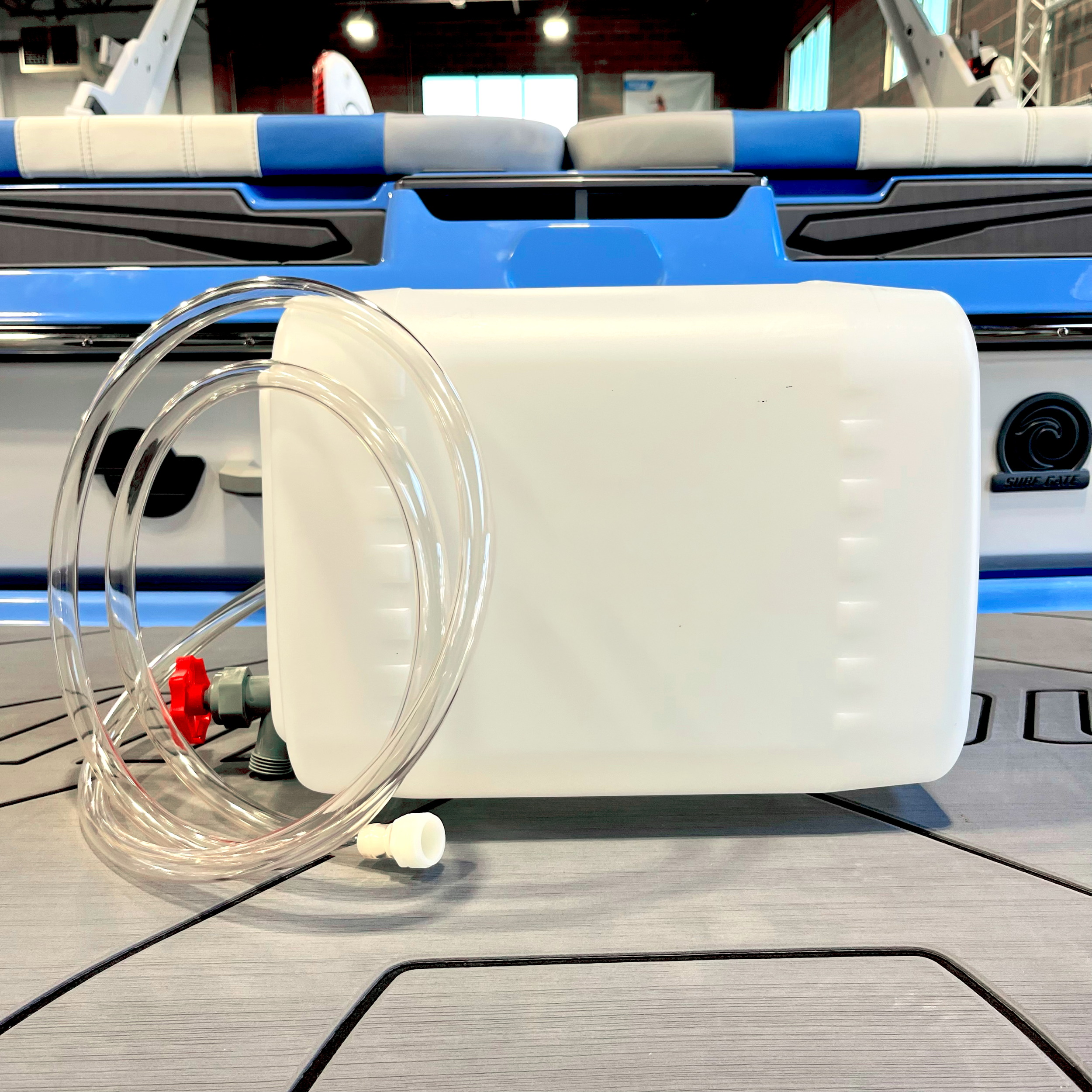 5-gallon winterize jug with attached hose, designed for easy winterization of Malibu and Axis boats.