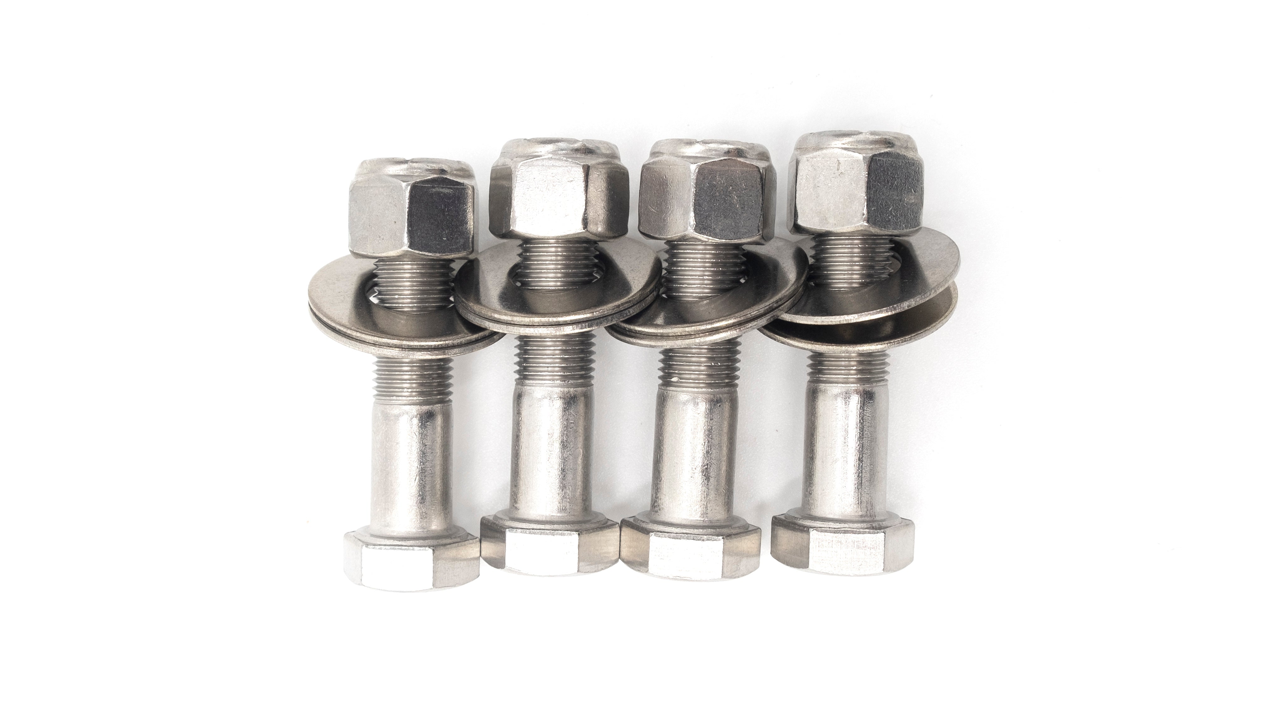Four stainless steel wedge bracket hardware bolts with nuts and washers, used for secure structural assembly or reinforcement.