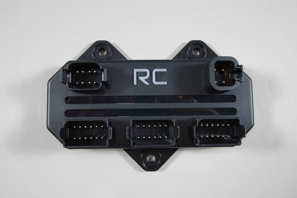 RGB Stereo Controller RideController with multiple connector ports and "RC" label, used for controlling RGB lighting in vehicles.