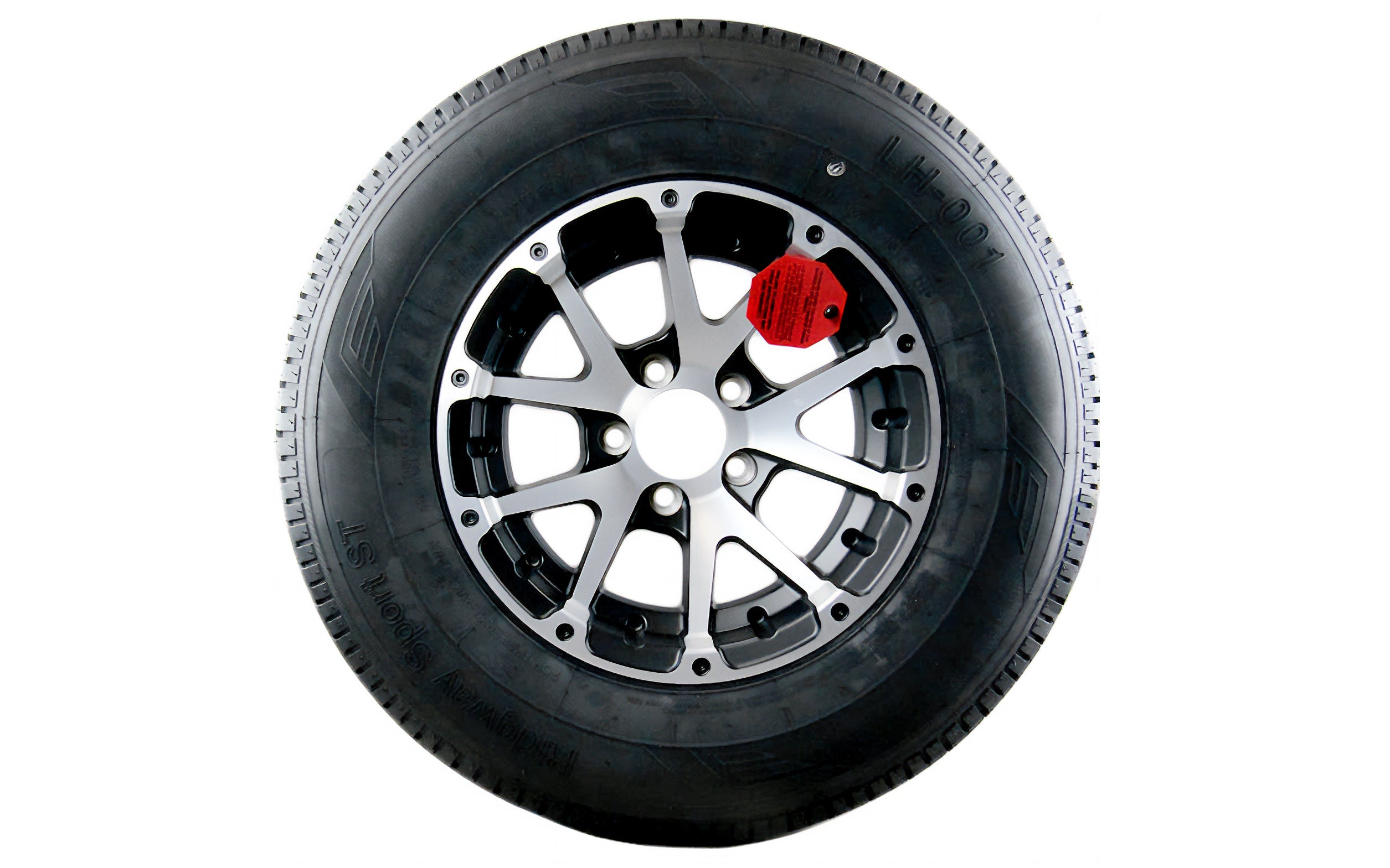 Alt text: "14-inch Snowflake alloy wheel paired with a black tire, showcasing a multi-spoke design in silver and black with a red warning tag attached."