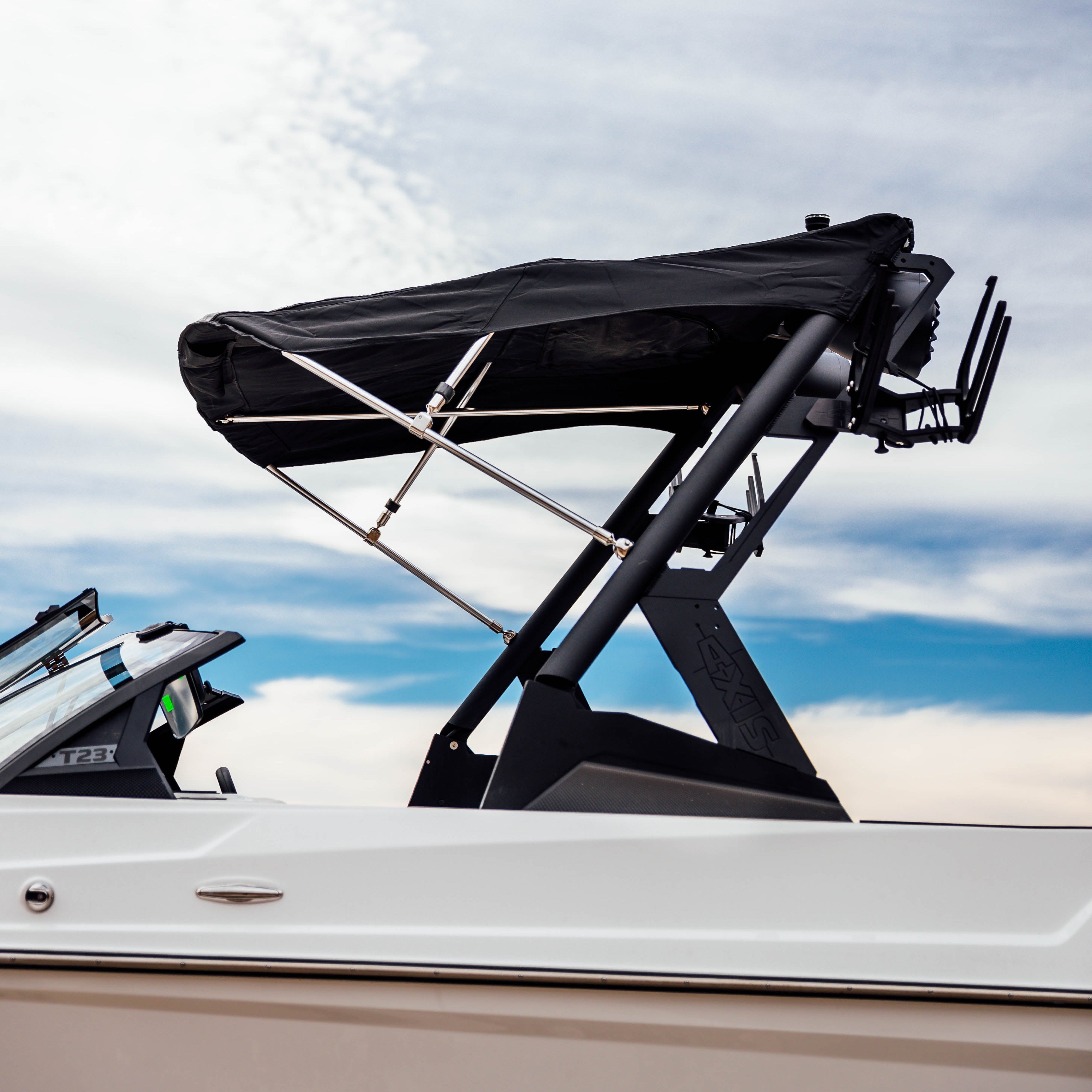 Axis AW20 Bimini Complete, 20'-24' boat bimini top with black fabric and stainless steel supports on a white boat.