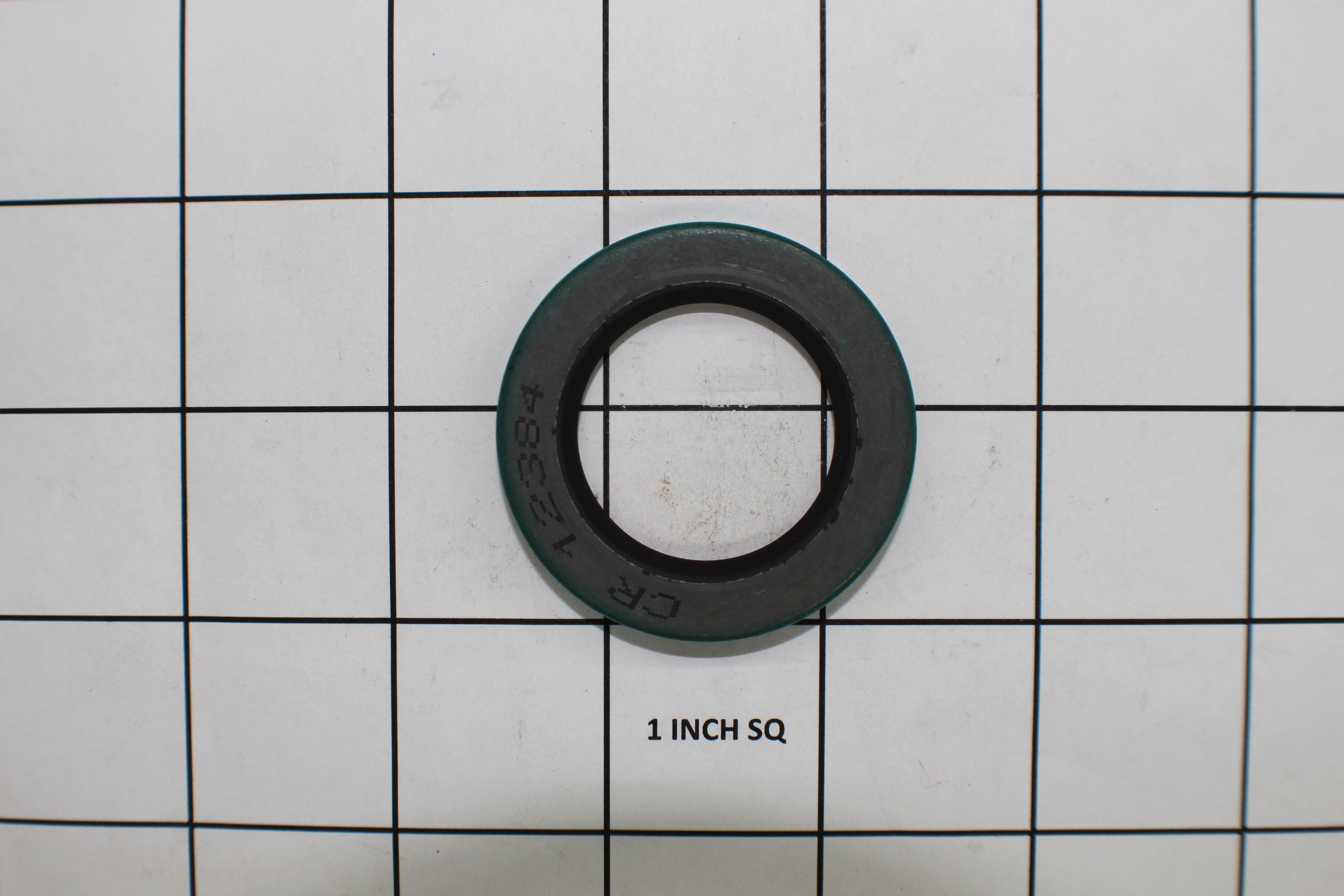 Input seal for Malibu and Axis boats, featuring a circular design with a black rubber center and green outer ring.