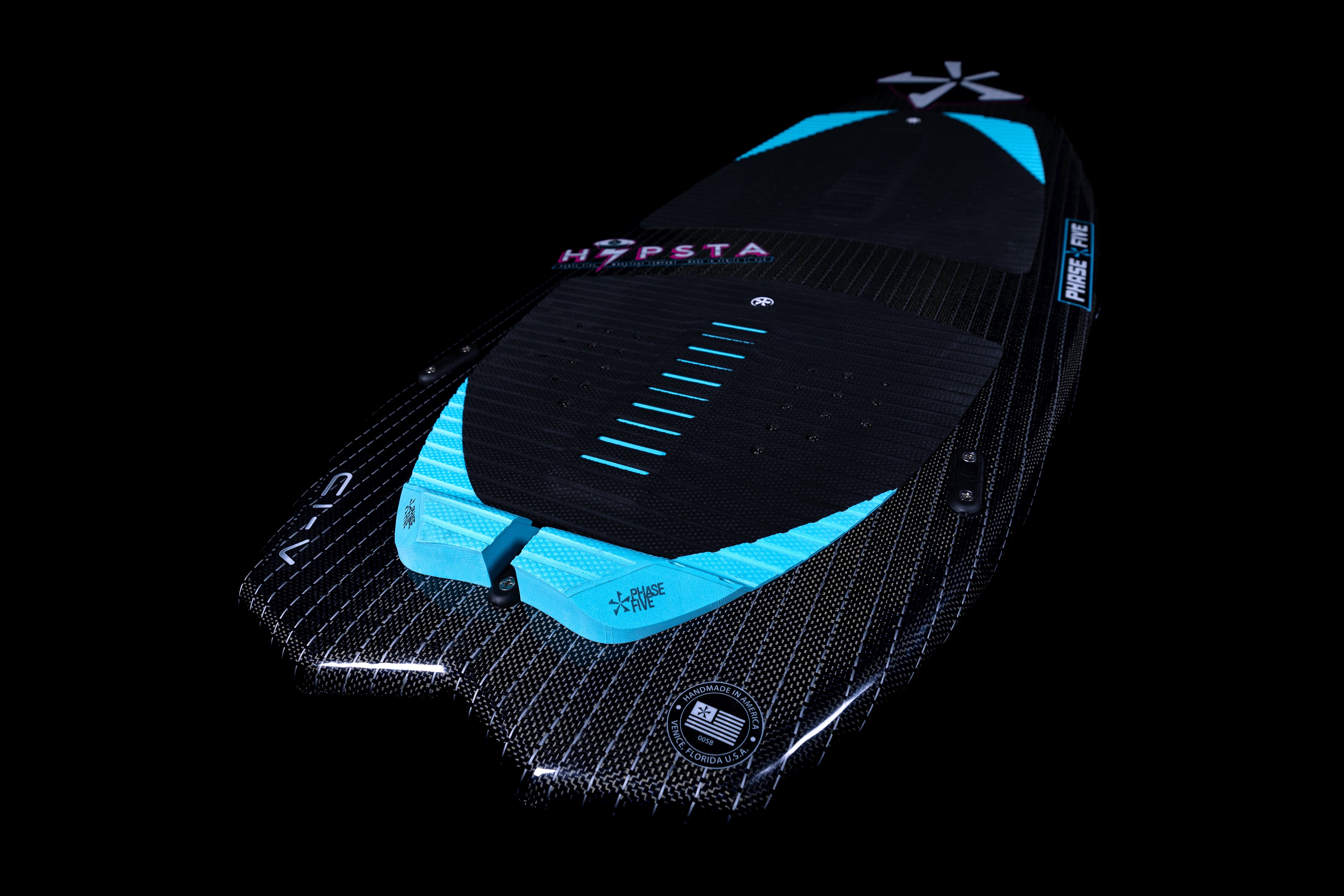 2025 Phase 5 Hypsta skim board featuring a sleek design with a black and blue color scheme and textured surface.