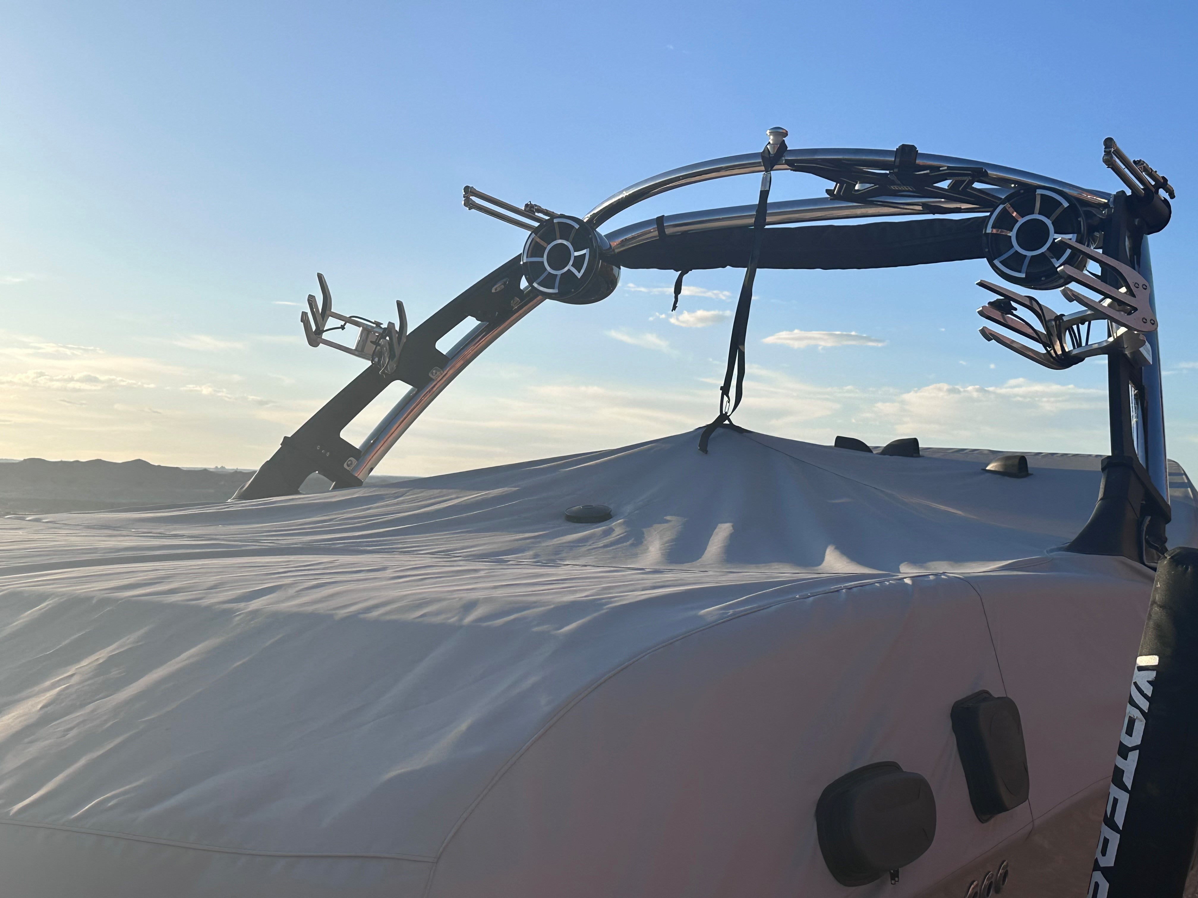 24 MXZ Cover for G3 Tower, a protective cover installed on a boat's tower with mounted speakers and equipment.