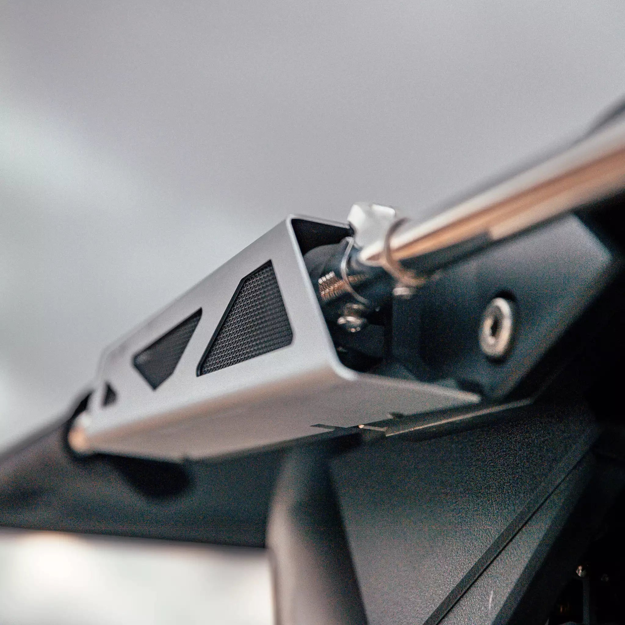 Close-up of Malibu GX Bimini hardware kit mounted on a boat, featuring metallic and black components for 2019-2023 models.