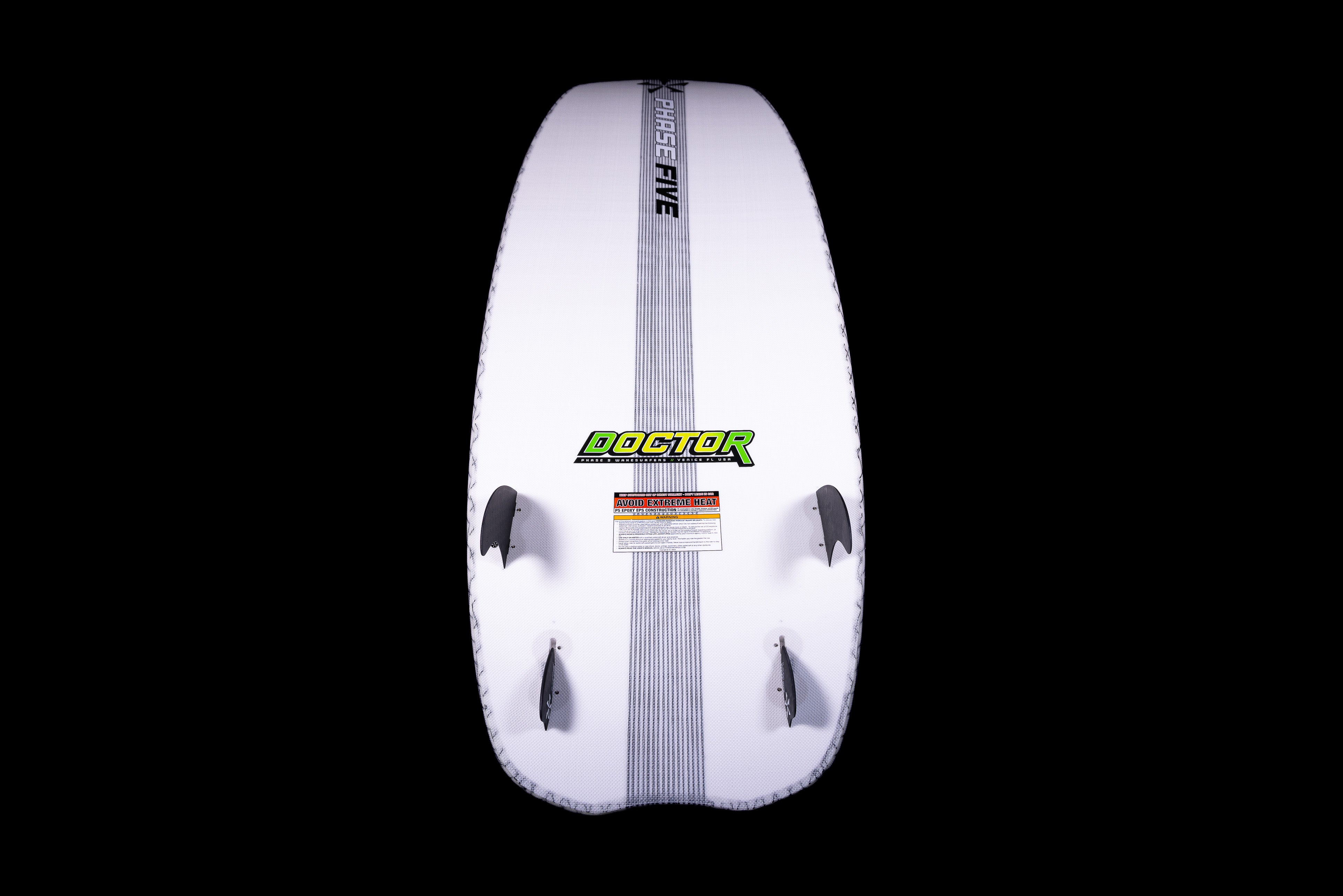 White Doctor Surfboard for 2025 Phase 5, featuring black fins, a central gray stripe, and bold green and black branding.