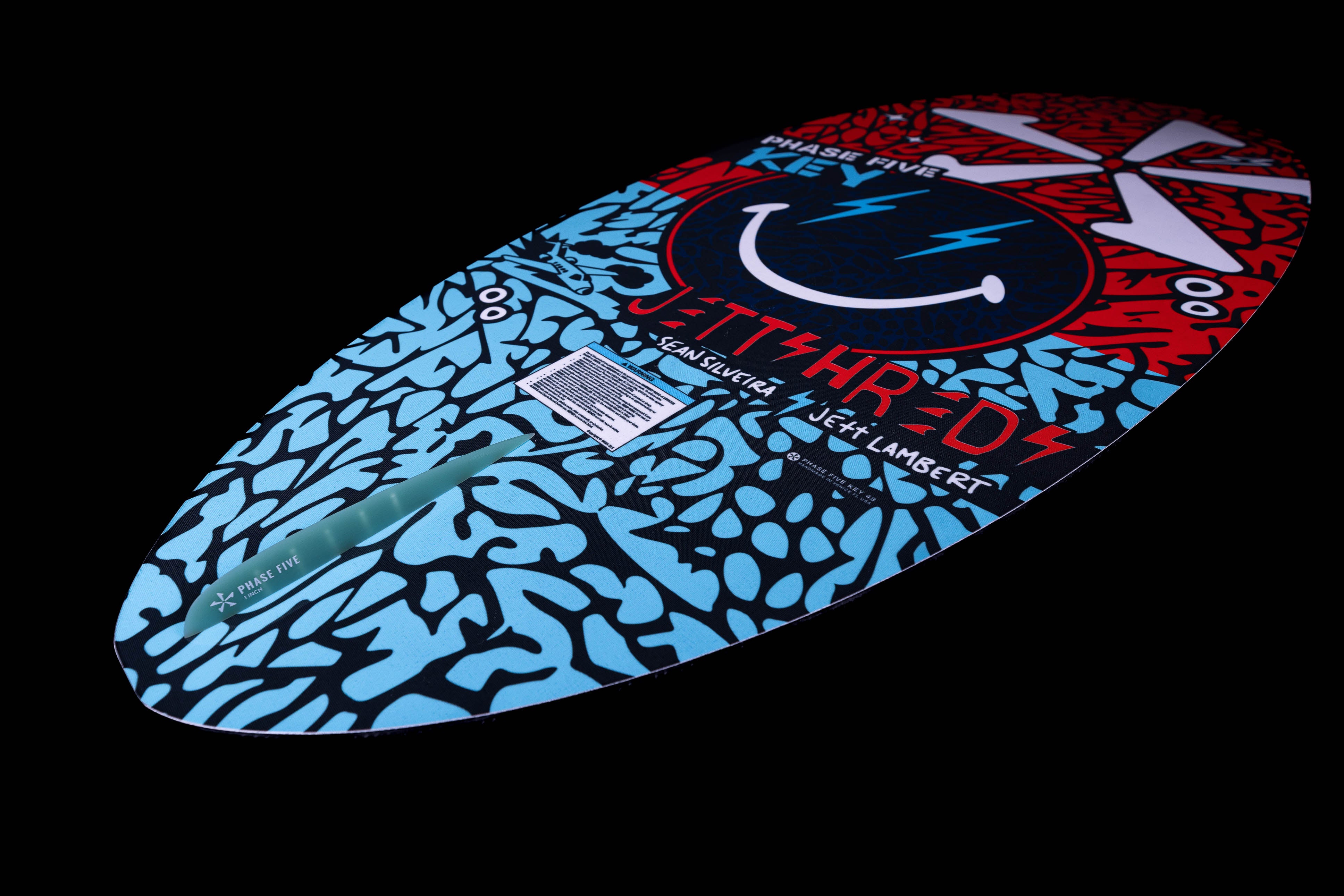 2025 Phase 5 Key Jett Shreds skimboard featuring a vibrant design with a smiley face and bold colors.