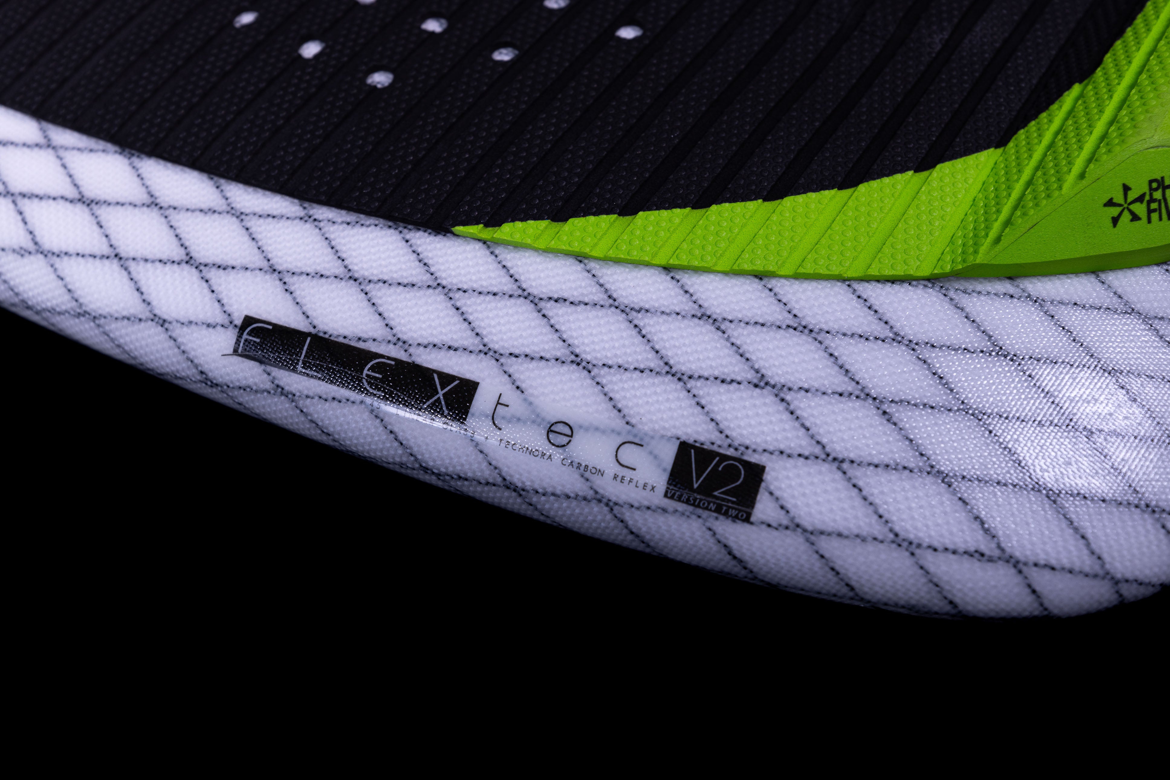 Close-up of the 2025 Phase 5 Doctor Surf Board with textured white, black, and green traction pads, showing brand labels and design details.