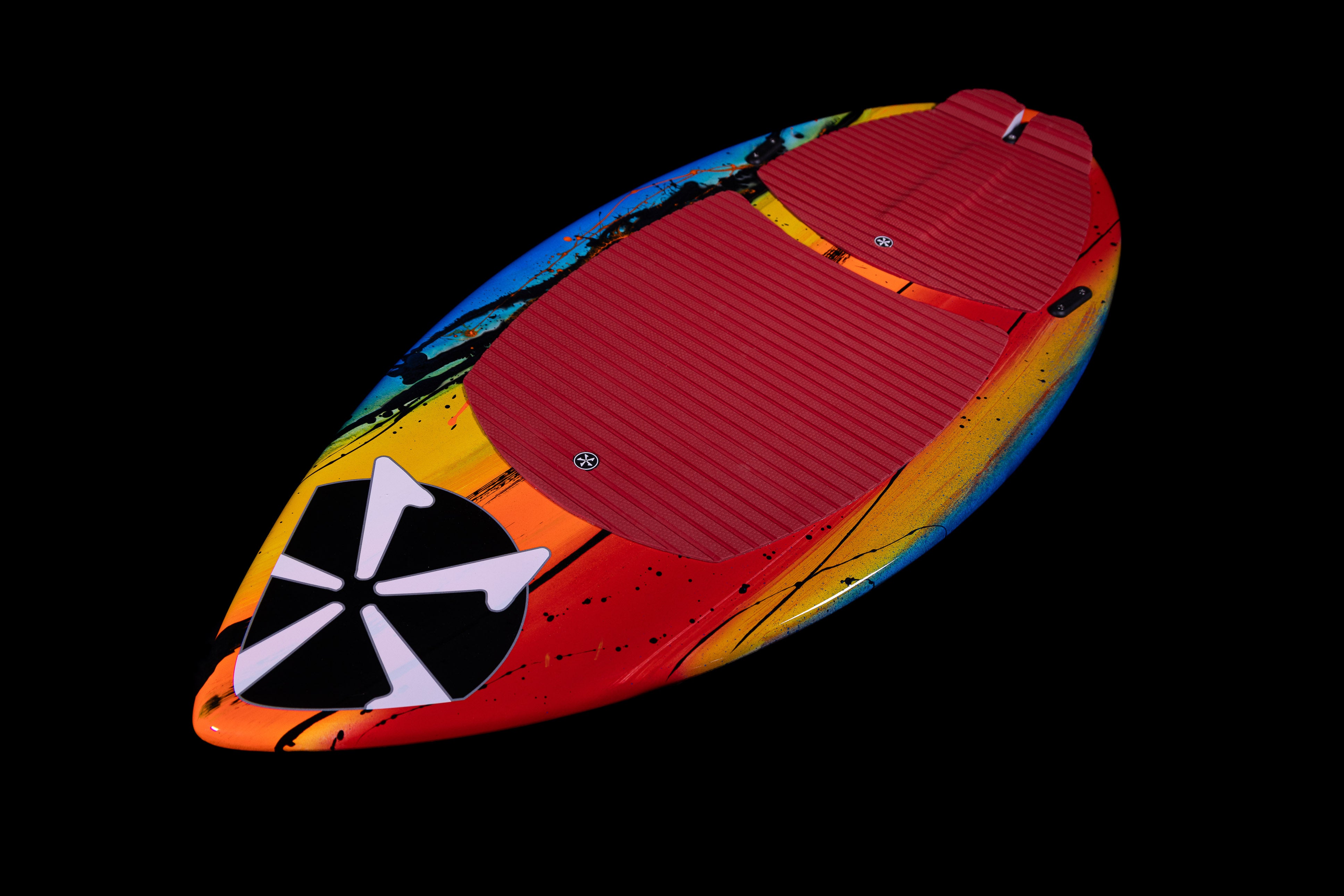 2025 Phase 5 Scamp Skim Board featuring a vibrant multicolor design and textured red foot pads for grip and control.