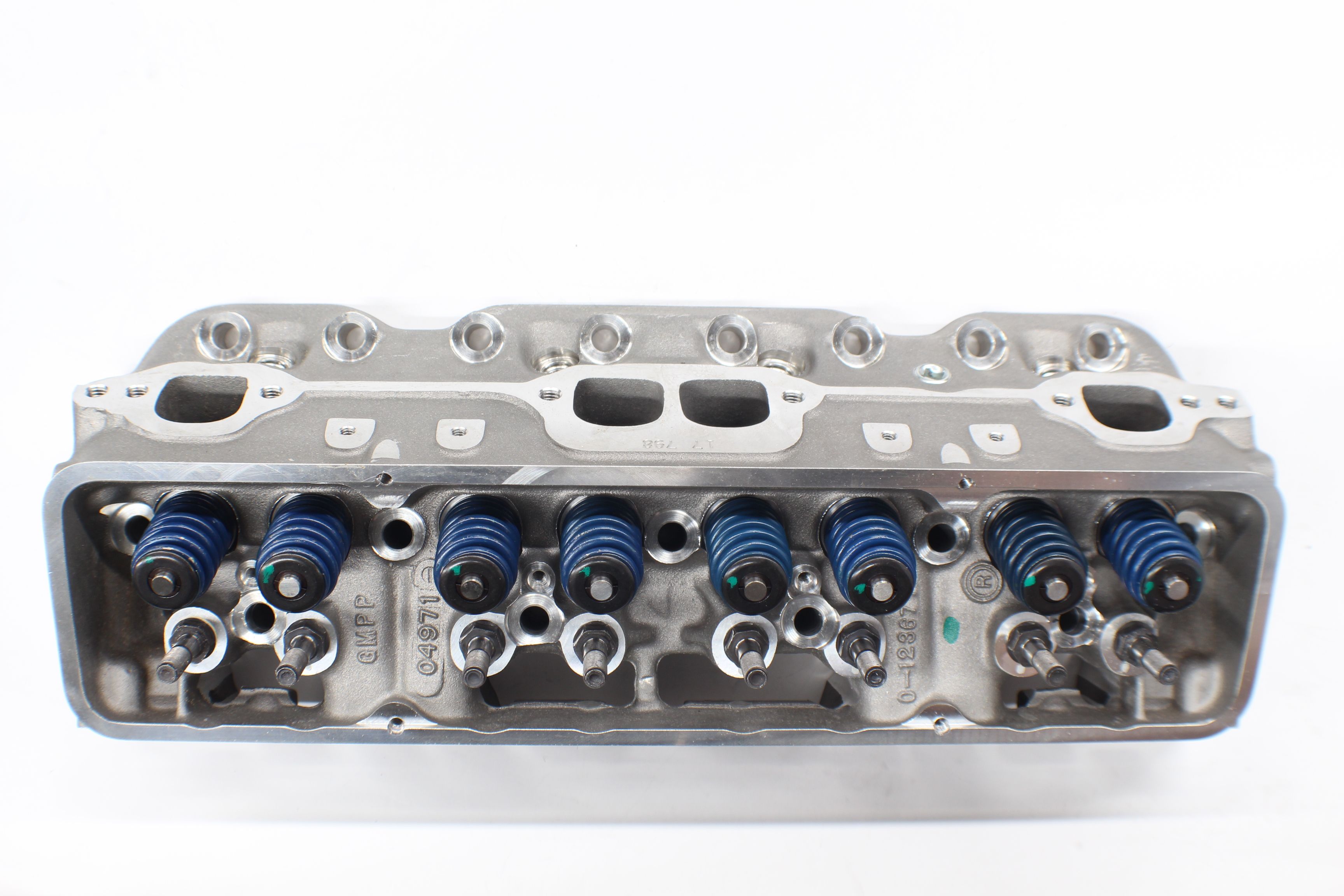 Head CYL Hammerhead engine cylinder head with valve springs and ports, used in automotive or motorcycle engines.