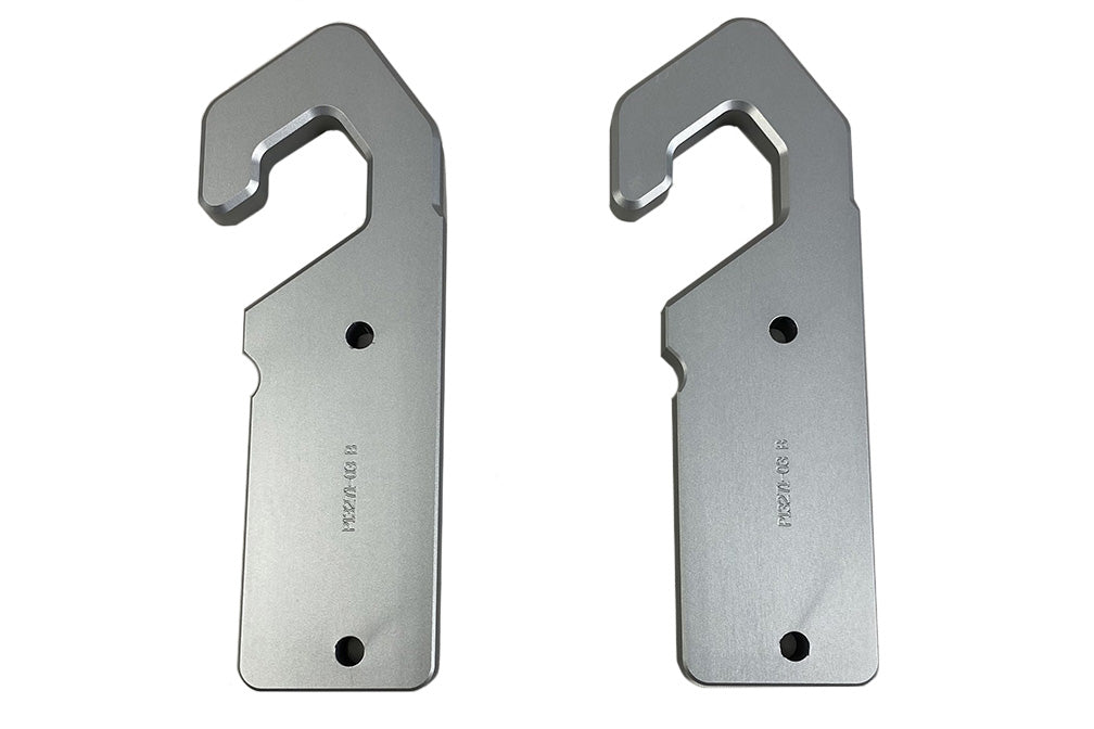 Pair of Gx Surf Tow Points, metal mounting brackets with hook ends for surfboard towing, silver finish, with mounting holes.