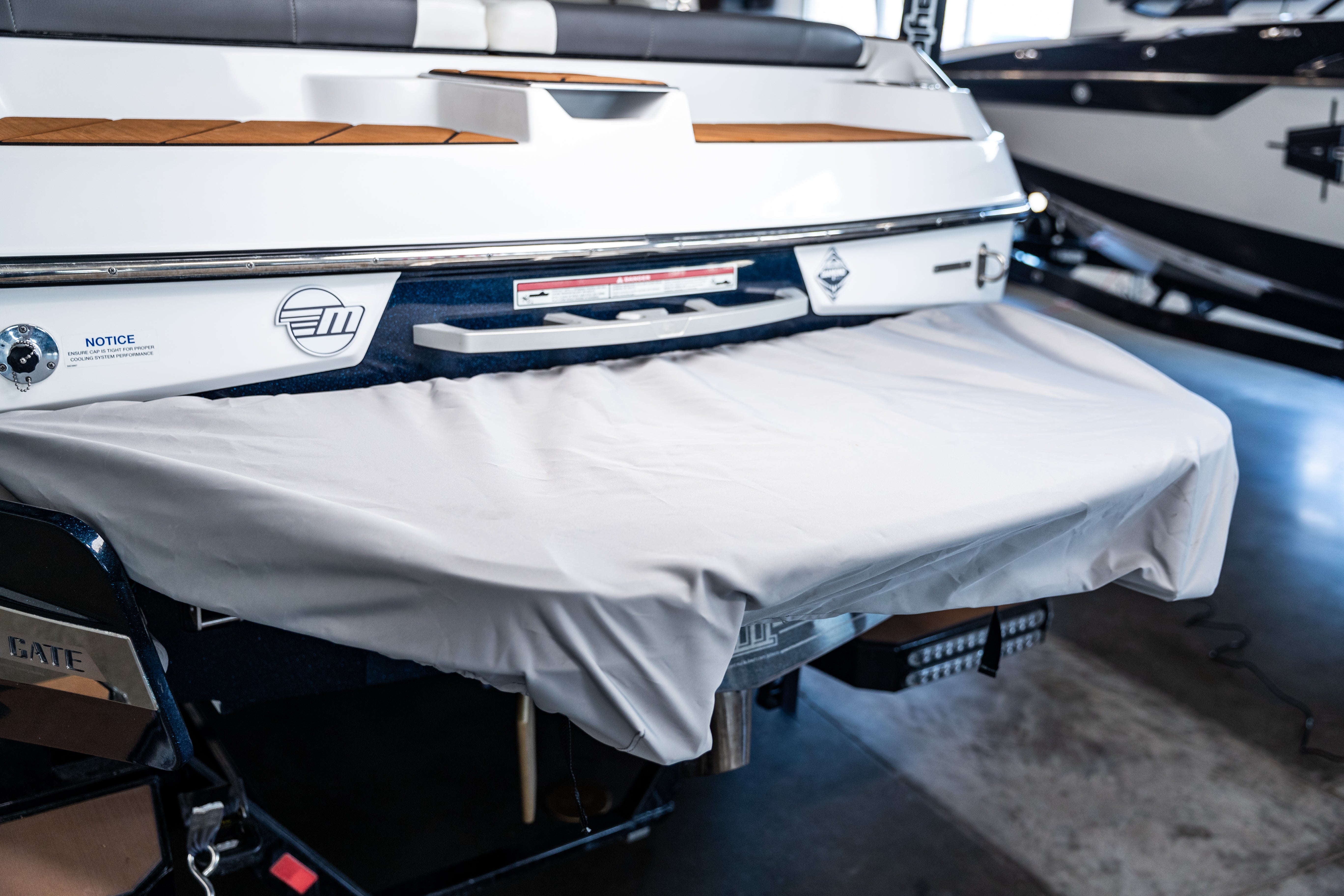 Swim platform cover for Malibu boats, model years 2016-2018, protecting the platform from dirt and damage.