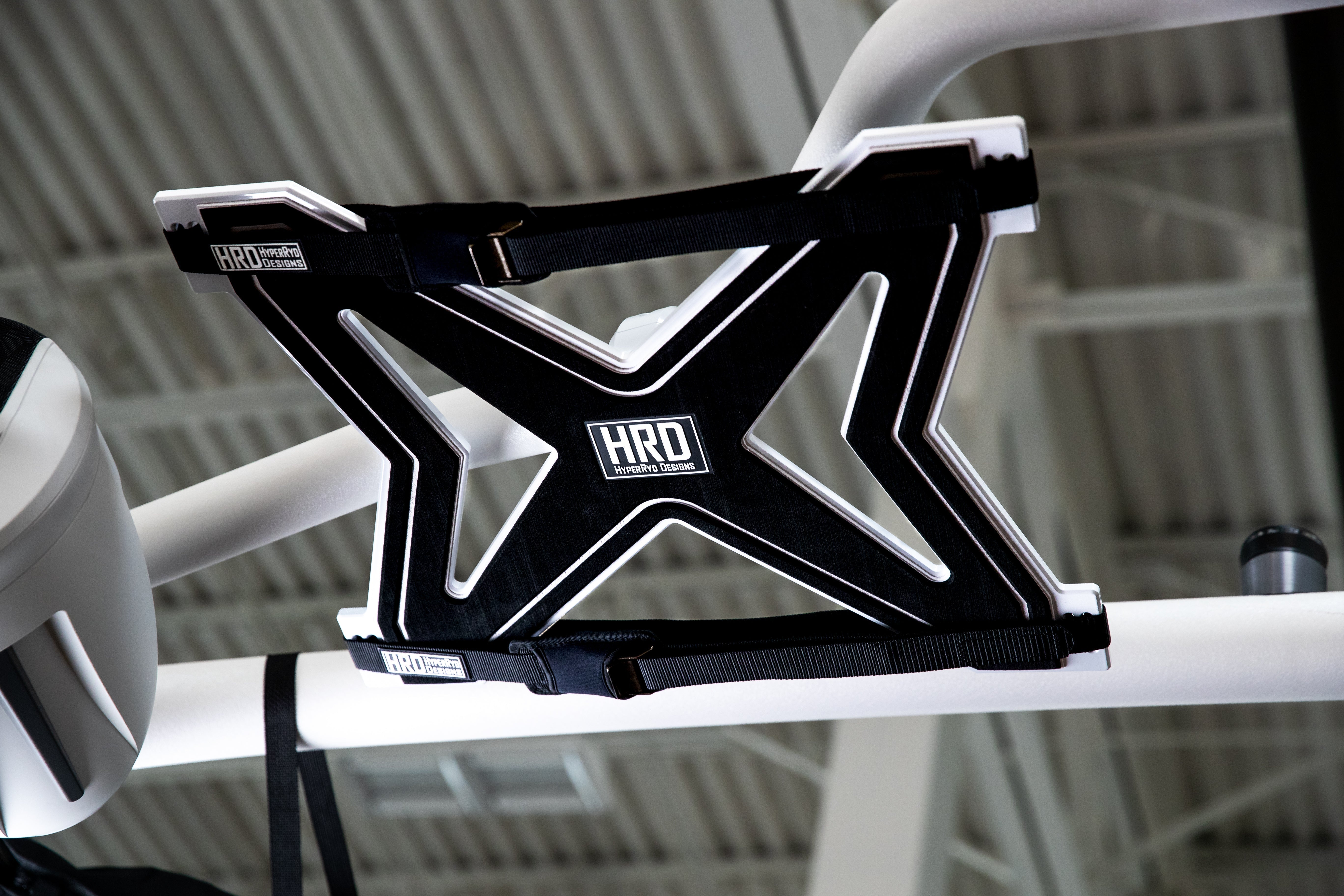 Black and white XR1 surf rack mounted on G3 and G5 towers, designed for carrying surfboards on a vehicle roof.