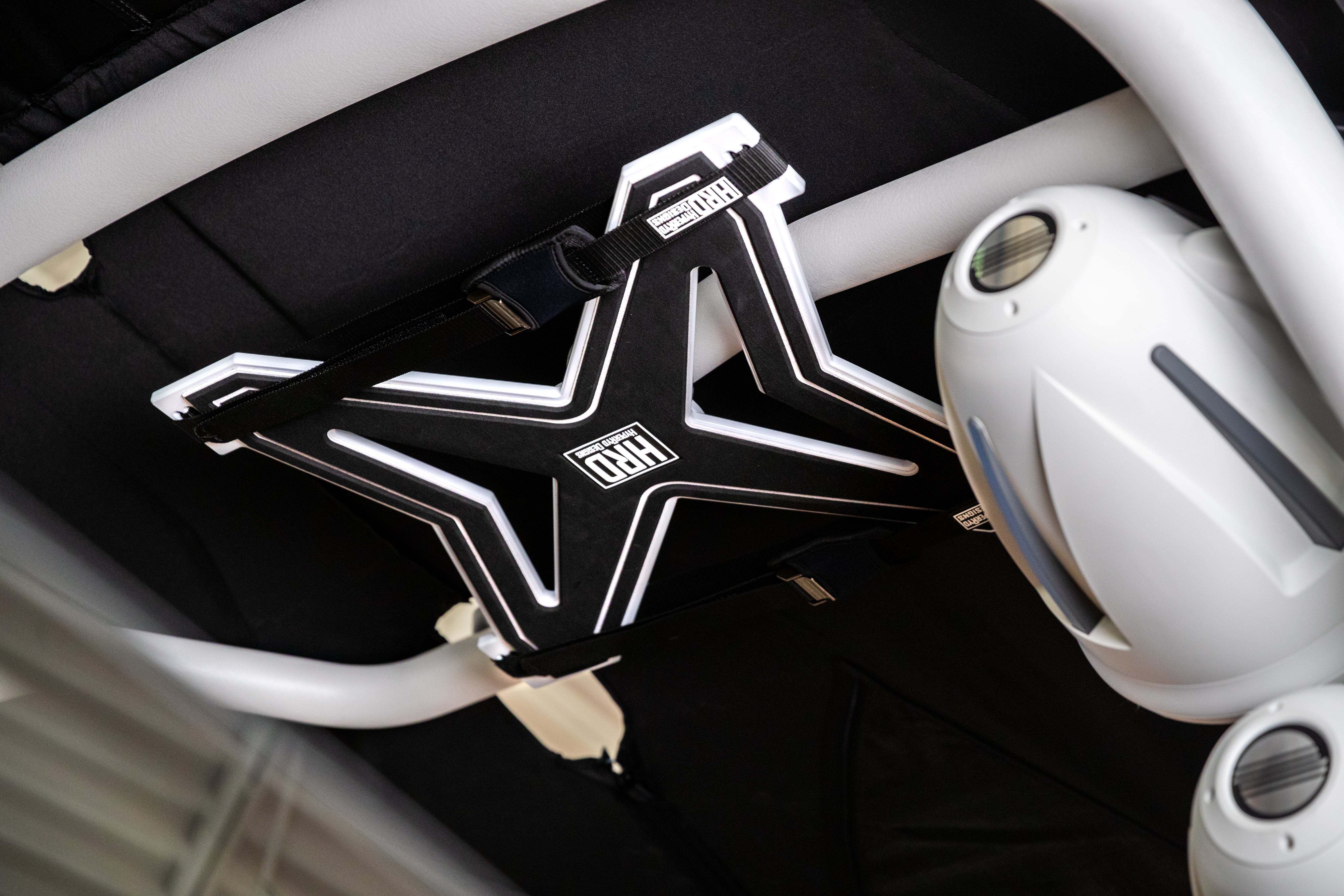 Black and white XR1 Surf Rack with G3 & G5 towers secured in a vehicle's interior, ready for surfboard transportation.