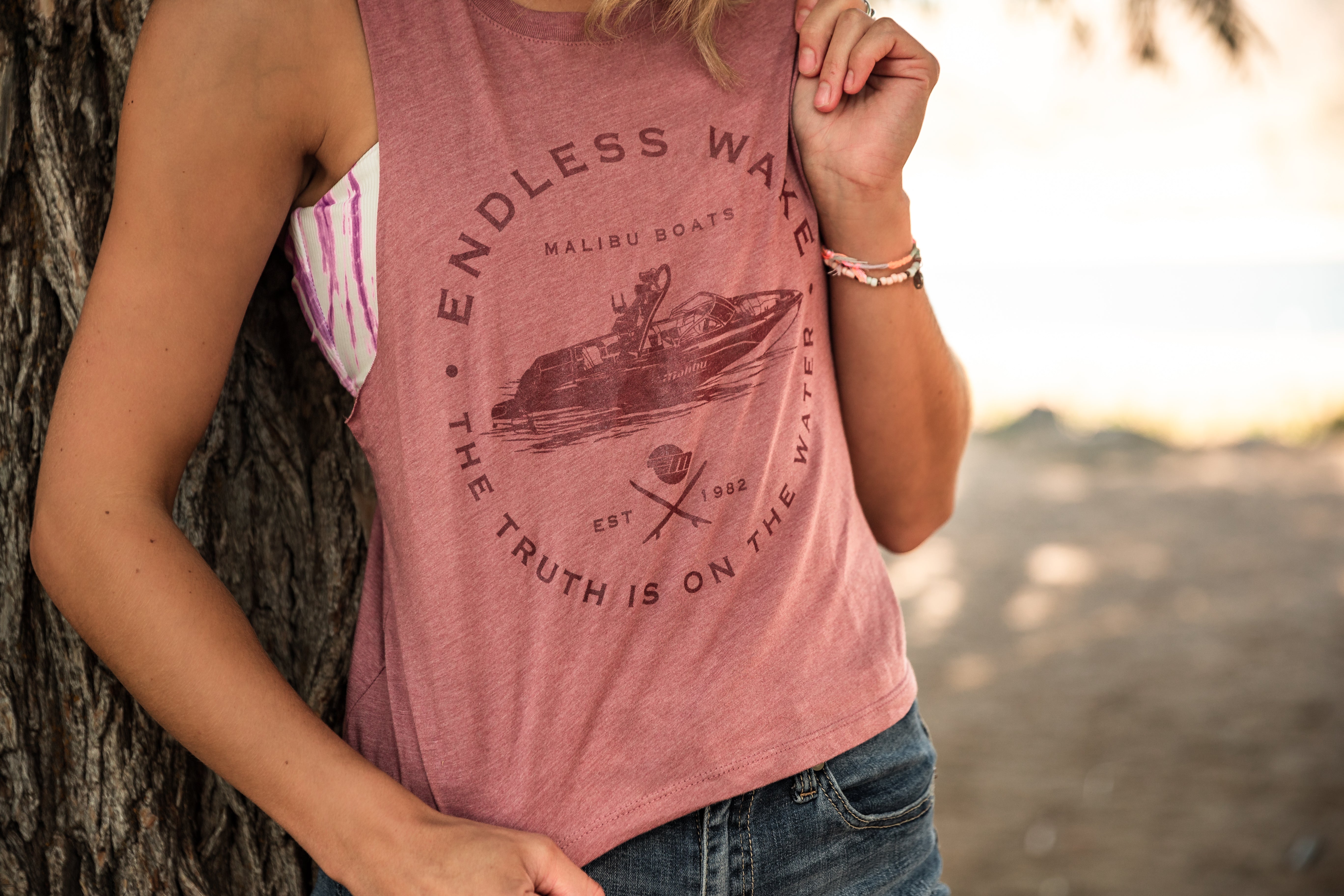 Women's sleeveless cropped tank with a graphic print featuring a boat, casual style, and relaxed fit.
