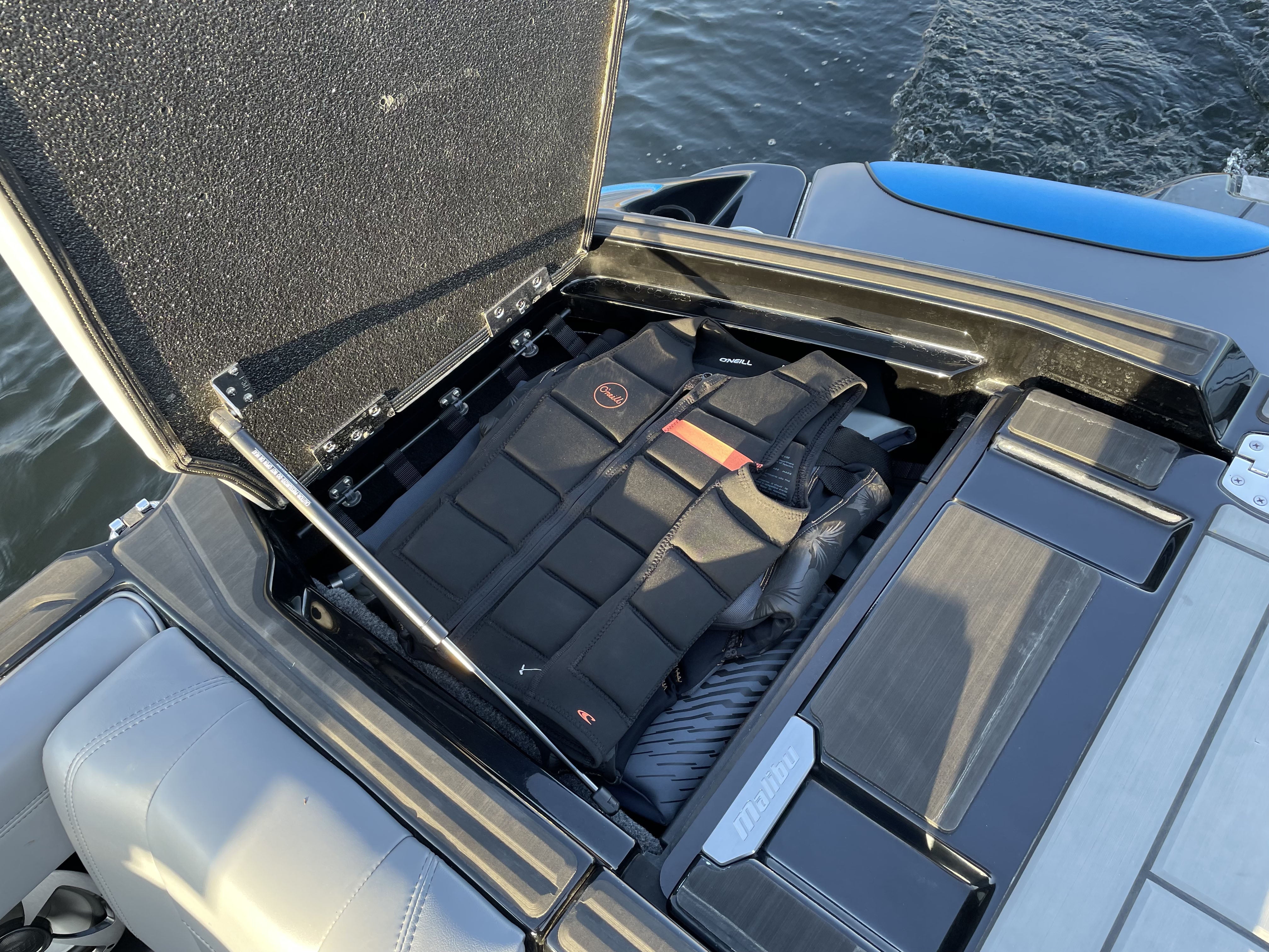 Pair of HRD Locker Nets stored in a boat's storage compartment, designed for secure gear organization on watercraft.