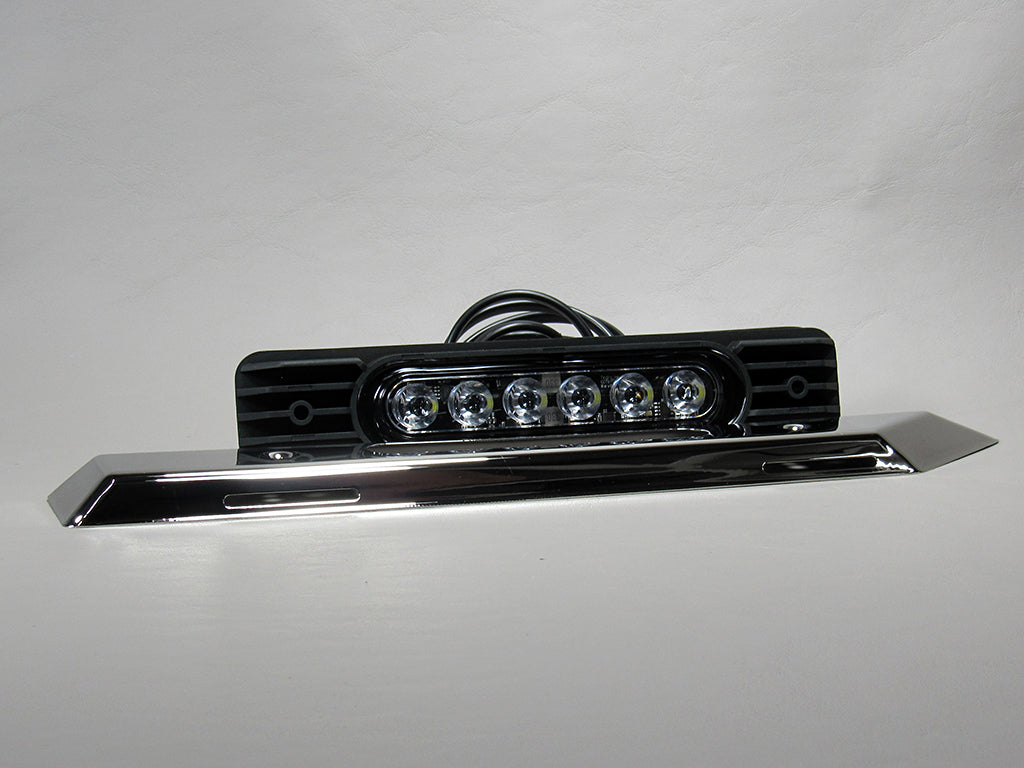 Docking light with LED bulbs, black housing, and chrome trim, designed for marine or vehicle use.