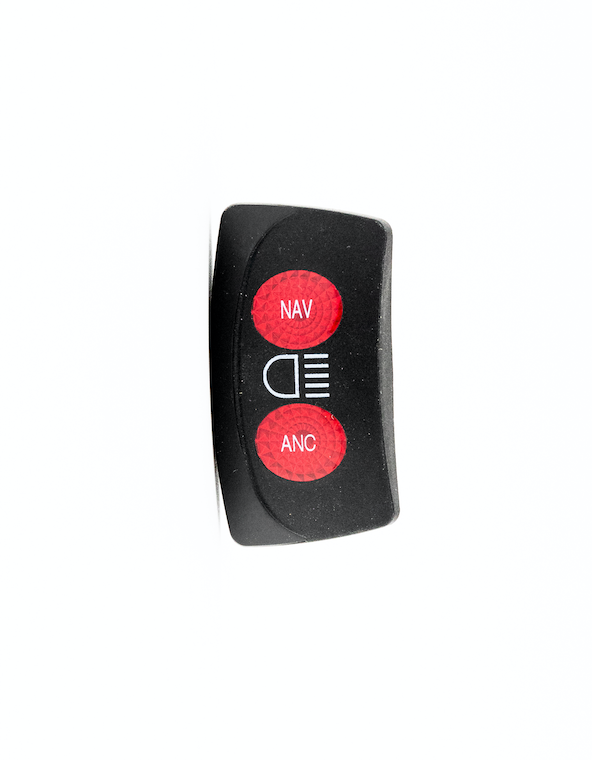 Close-up of a black Nav/Anchor switch cover with red buttons labeled "NAV" and "ANC" for marine navigation and anchor functions.
