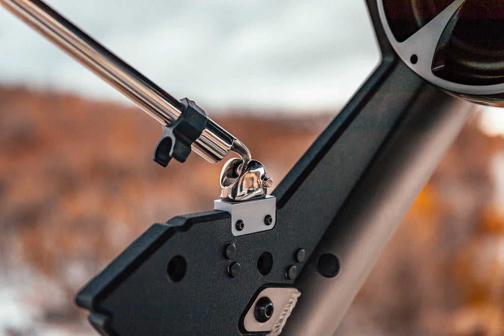 Black Bimini support pole clip, 7/8" diameter, attached to a boat's frame for securing the bimini top.