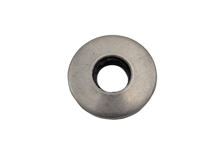 Close-up of a gray in-tank fuel pump washer with a central hole, used to seal and secure fuel pump components.