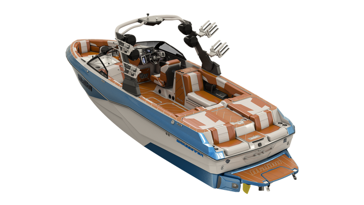 Colorful Malibu boat with a white, blue, and orange design, featuring a windshield, seating, and a wakeboard tower.