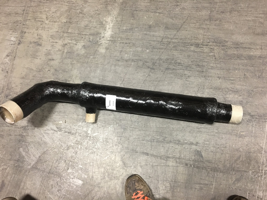 Black marine muffler with 3-1/2 inch outlet, designed for starboard side, UYT model, for 2015-2019 boats, lying on a concrete floor.