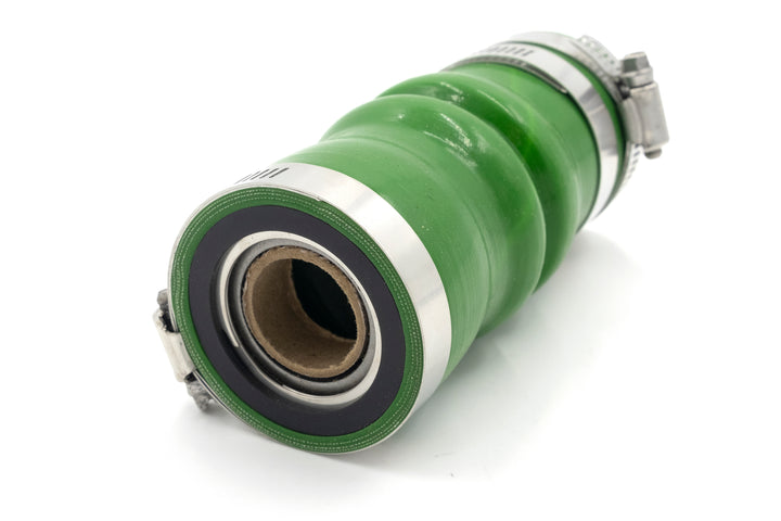 Green shaft seal, 1-1/4 inch, OJ type, with metal clamps, designed for industrial machinery.
