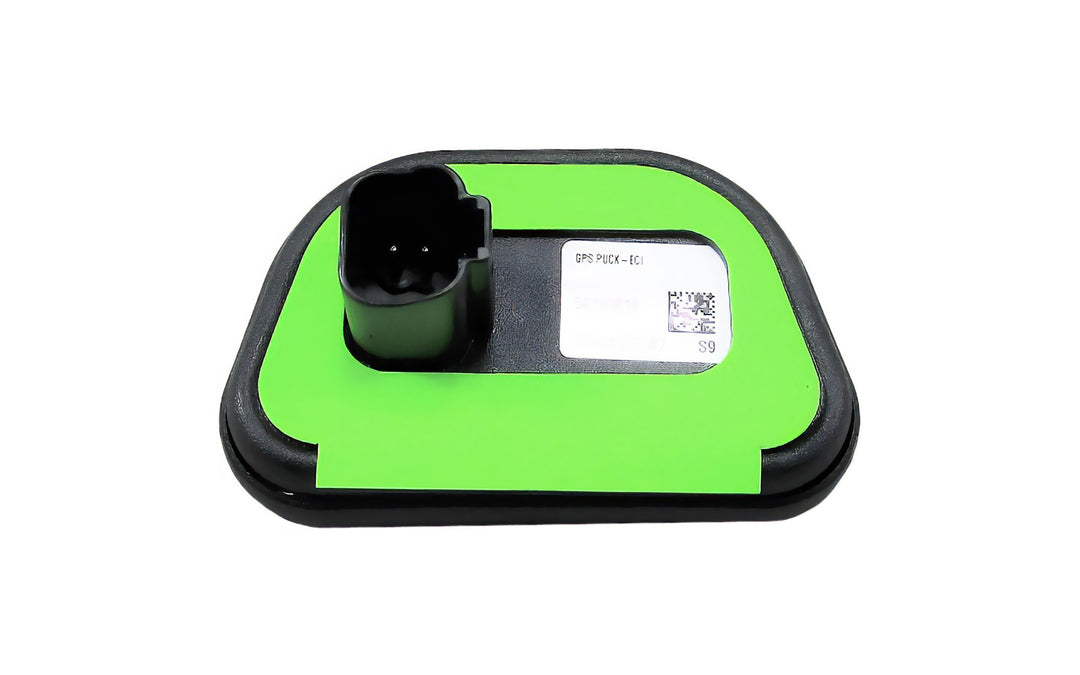 GPS antenna/puck with a black connector mounted on a green and black base, designed for GPS signal reception.