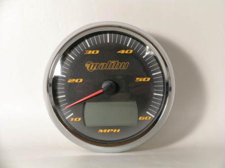Malibu speedometer gauge with a black face, yellow markings, digital display, and a red needle indicating speed in MPH.