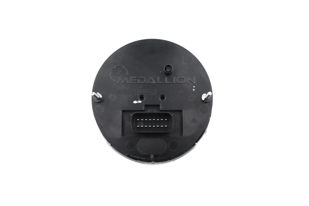 Back view of an Axis Tachometer Gauge showing electrical connector and mounting points on a black plastic surface.