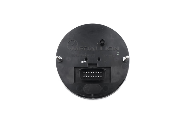 Back view of an Axis Tachometer Gauge showing electrical connector and mounting points on a black plastic surface.