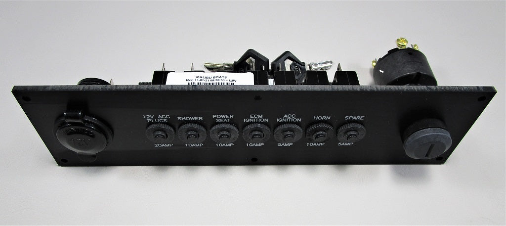Malibu Circuit Breaker Panel 2021 with labeled switches for 12V accessories, shower, power seat, ignition, horn, and spare.