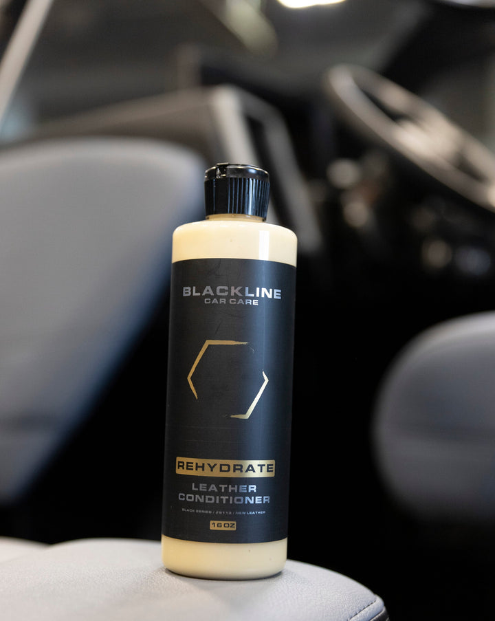 Bottle of Blackline Rehydrate Leather Conditioner for car leather care, designed to restore and maintain leather&
