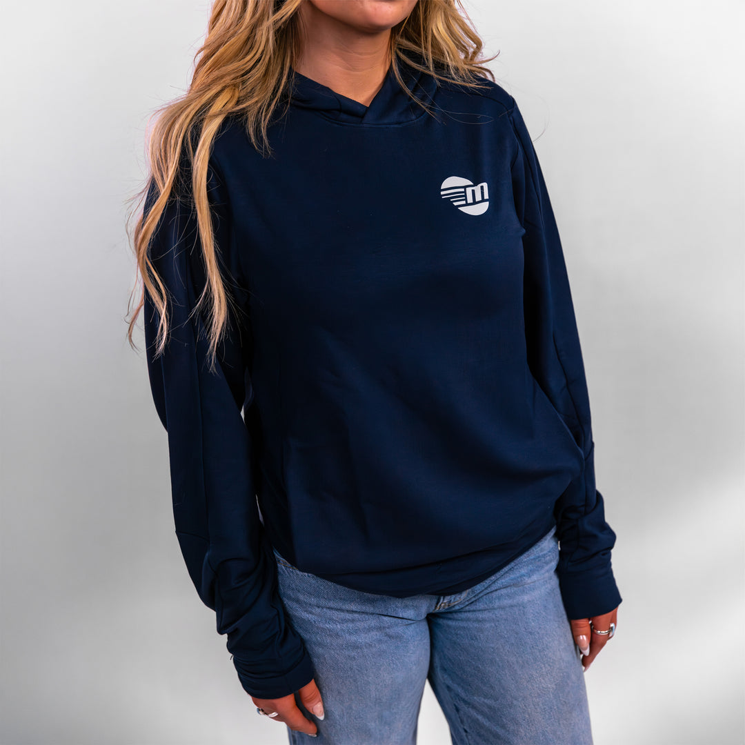 Navy Malibu Performance Hoodie displayed on a model, featuring a logo and a comfortable, stylish design.