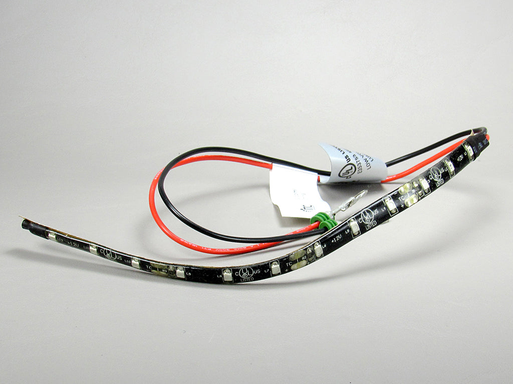 Blue LED light strip with black and red wires, flexible design, and small individual LEDs for decorative lighting.