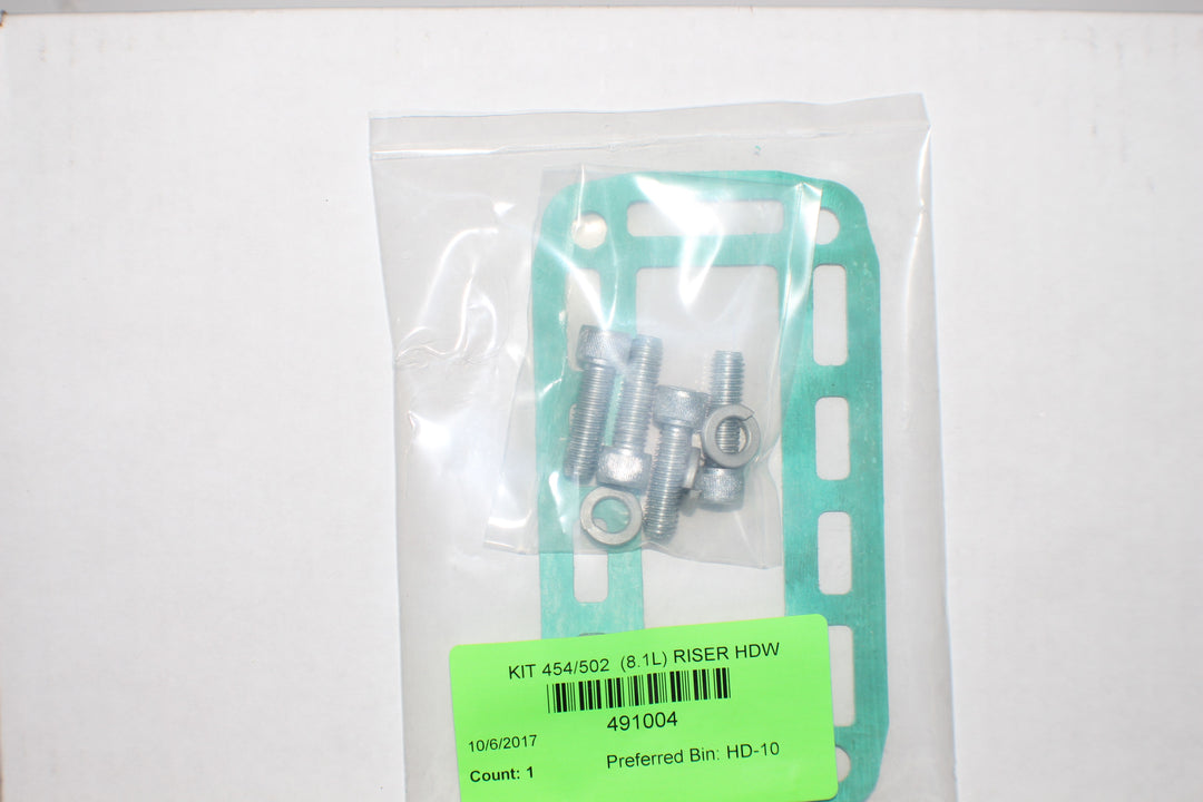 Metal hardware kit with bolts, nuts, and a gasket for 8.1L Riser HDW, packaged in a clear plastic bag with a green label.
