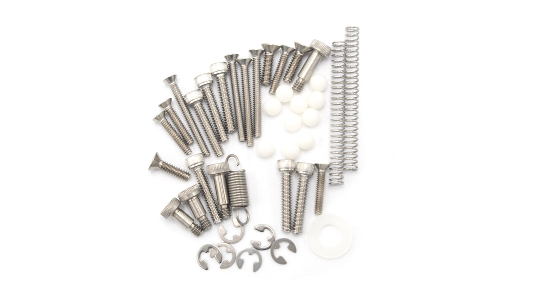 Silver screws, springs, white spacers, and clips arranged on a white background, part of the Sport Dash Hardware Kit.