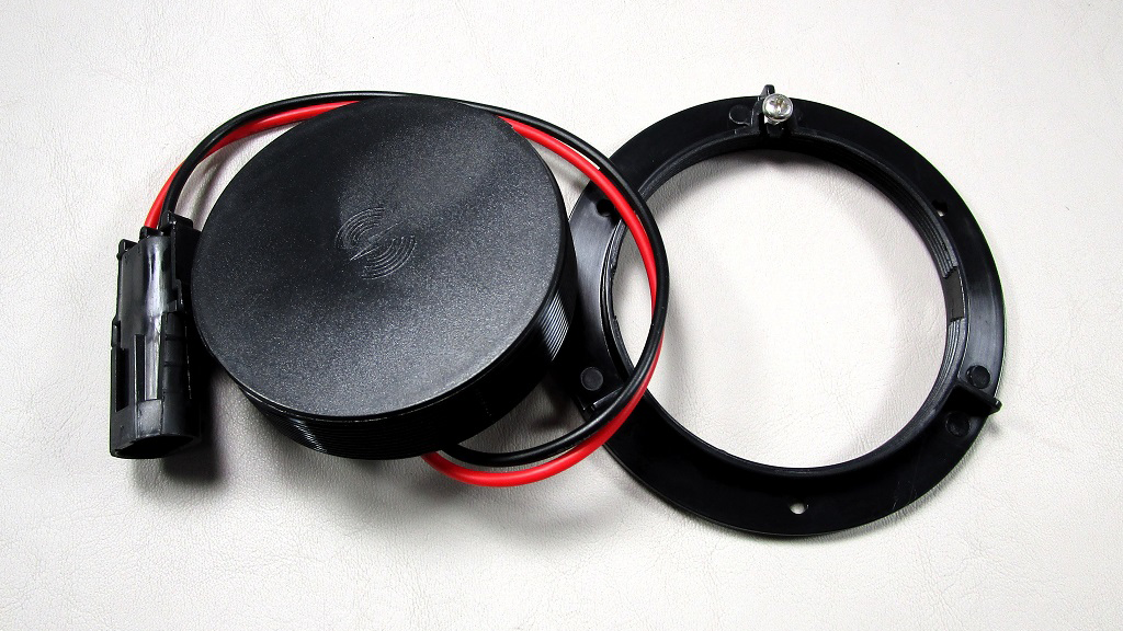Axis 10W wireless charger with mounting ring and power cable, designed for fast wireless device charging.