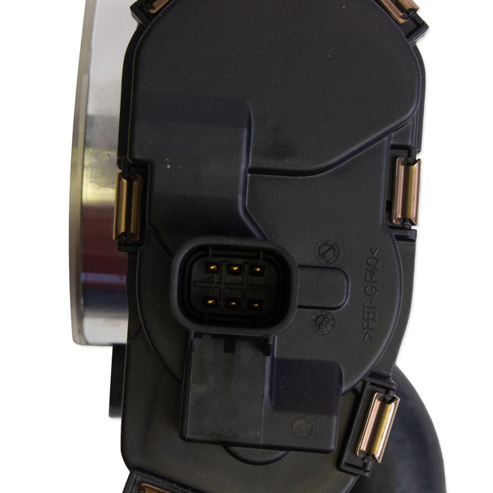 ETC Monovalve with 4 bolt connection, black plastic housing, electrical connector, used in automotive or industrial applications.