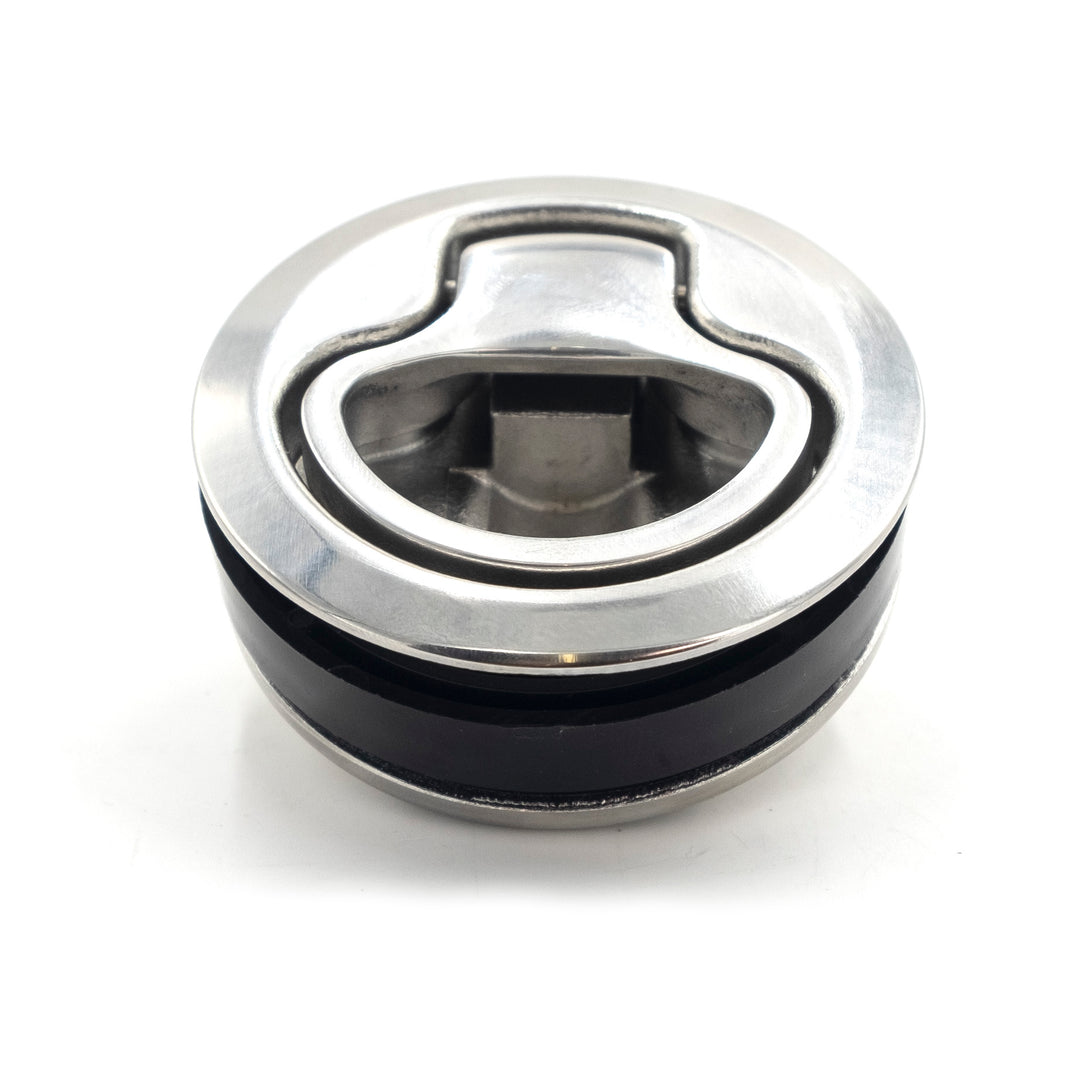 Wedge access door latch with metal and black components, designed for secure door closure and easy access.