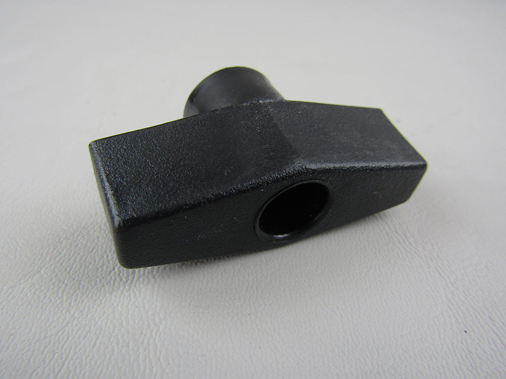 Black two-arm knob with a rectangular base and a cylindrical attachment, used for axis engine closeout, model 16.