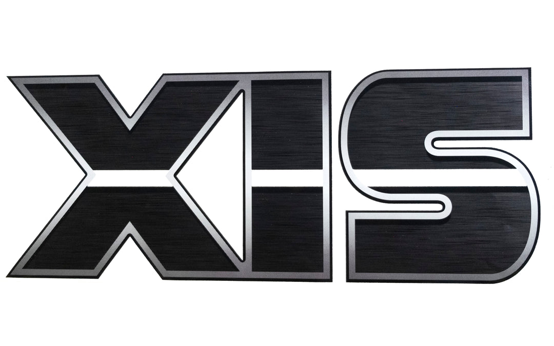 Black and silver "XIS" decal sticker with bold, stylized uppercase letters and a metallic finish.