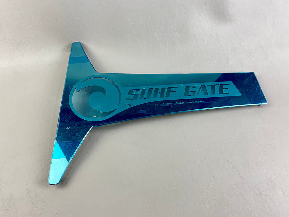 Blue Surf Gate Dress-up Plate with "Surf Gate" branding, designed for port side of a boat, made of reflective material.