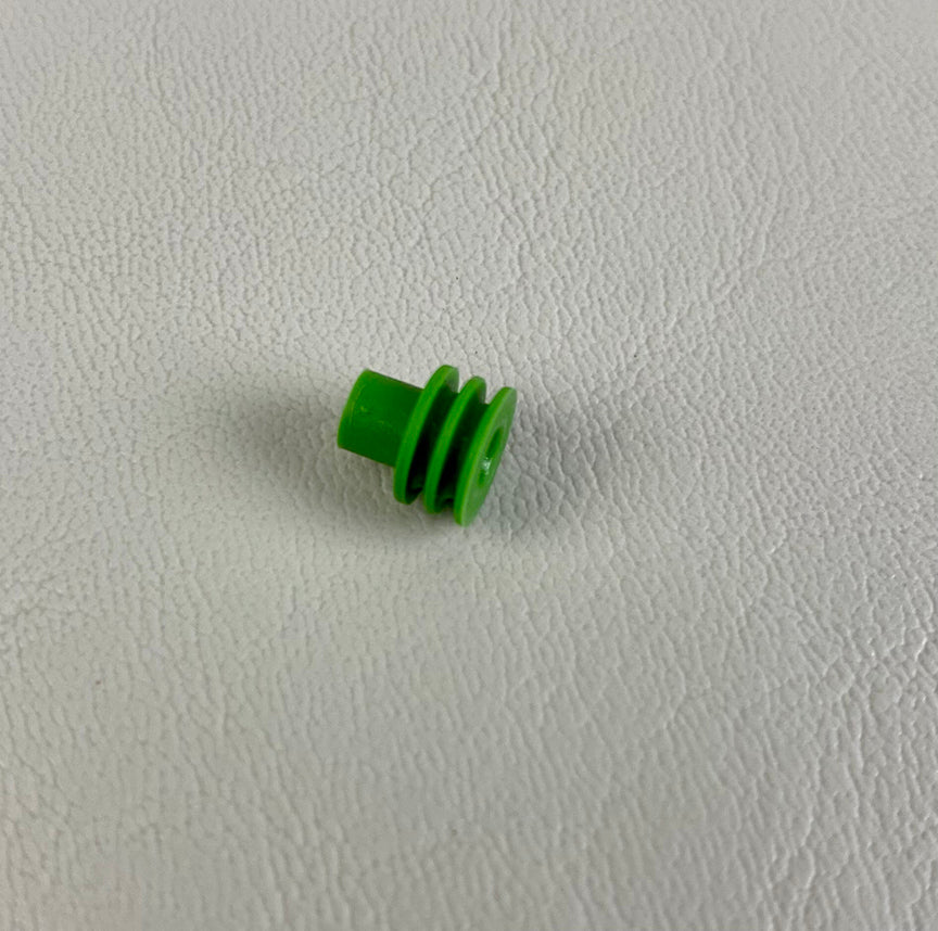 Green Delphi cable seal from the 280 Series, part number 15324982, on a textured white surface.