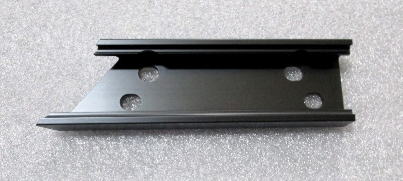 Black G10+ outside speaker mount on starboard side with multiple screw holes for secure installation.