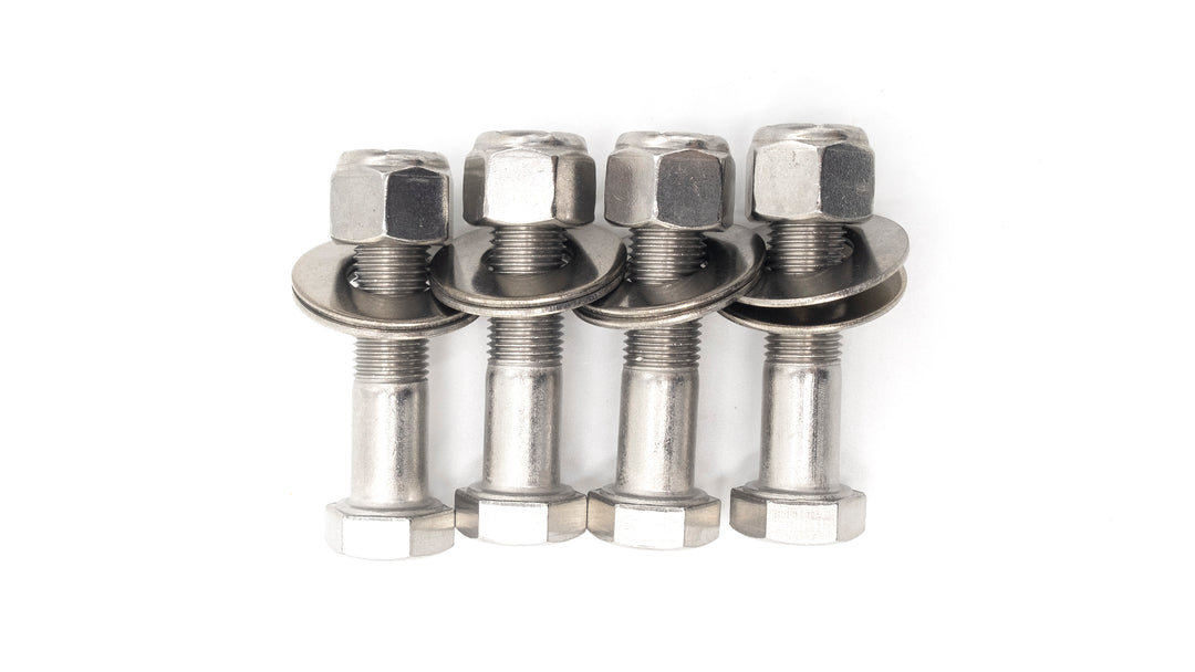 Four stainless steel wedge bracket hardware bolts with nuts and washers, used for secure structural assembly or reinforcement.