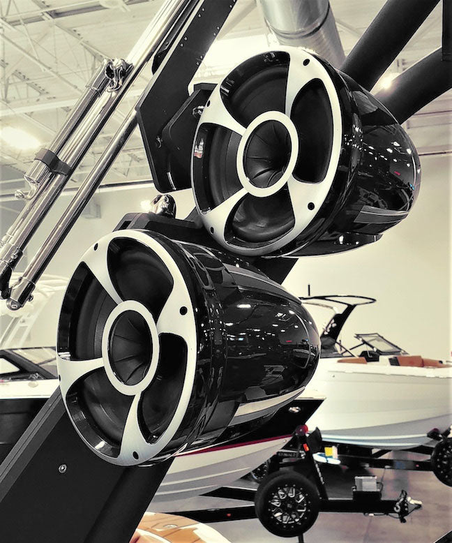 REV8 Malibu-Black tower speakers, 15-21 inches, wet sounds, mounted on a boat with a white hull and black accents.